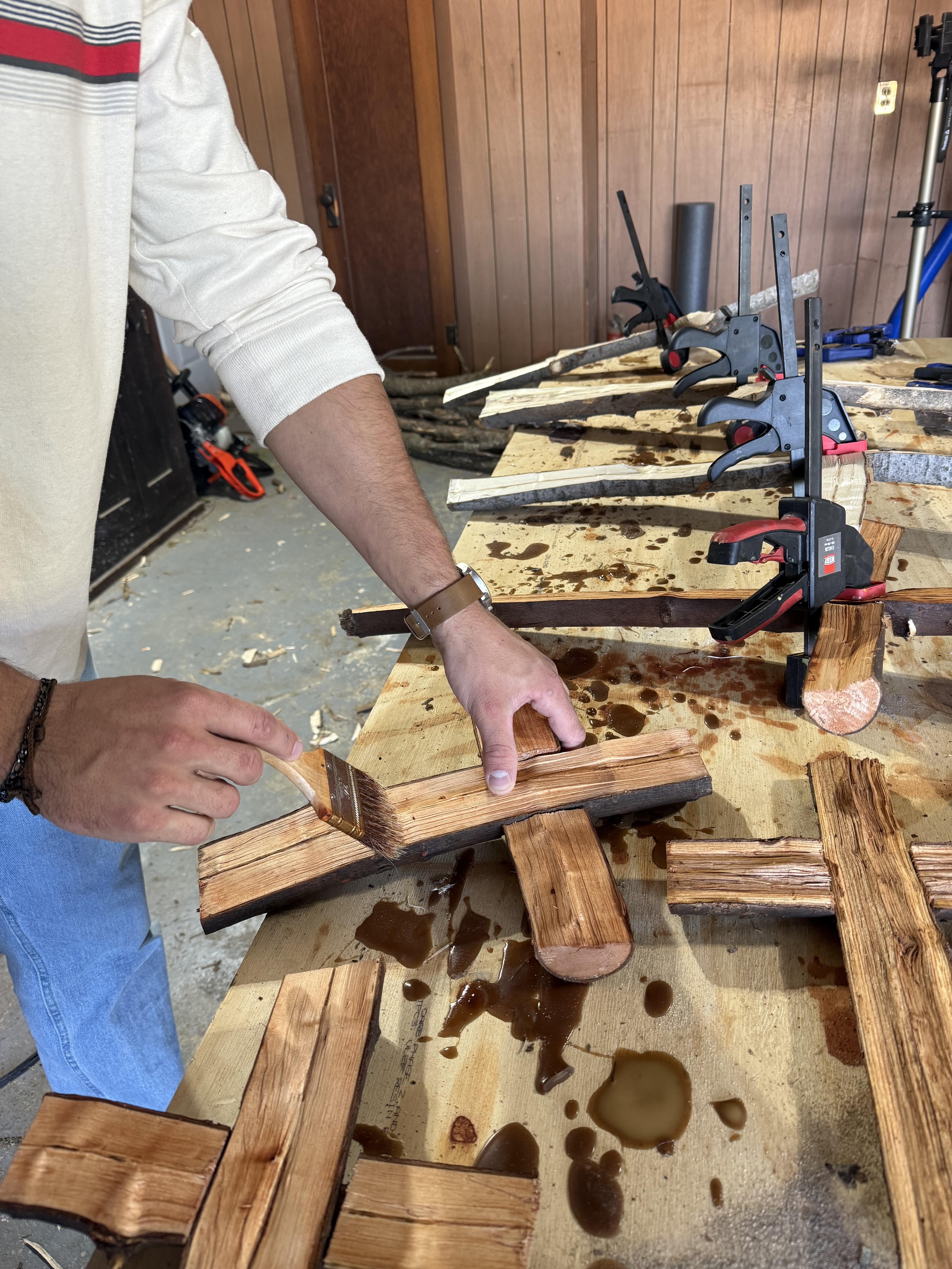 Danny Fisher staining the fitted branches of a cross